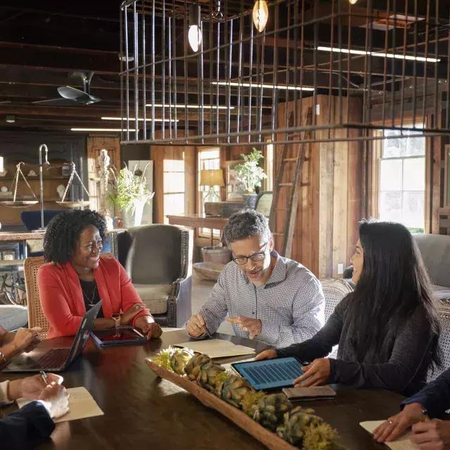 A group collaborates at a meeting in Monterey.